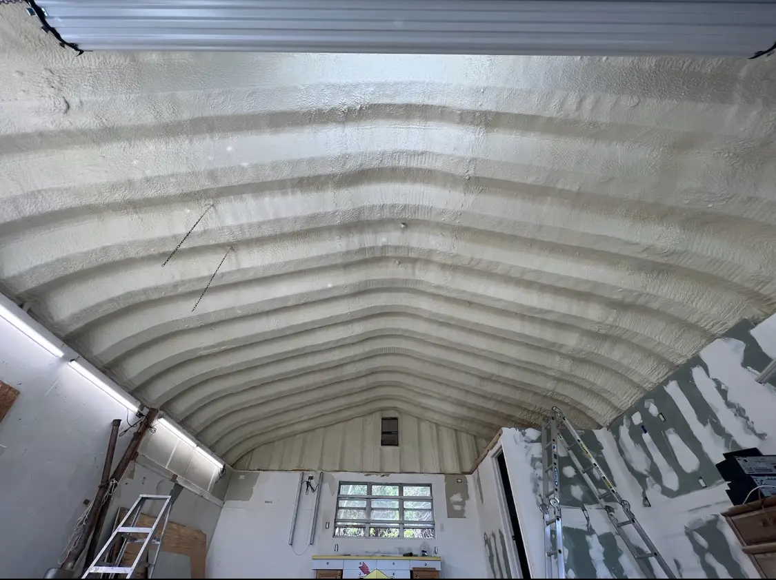 Spray polyurethane foam applied to the underside of a metal roof deck in Bulverde